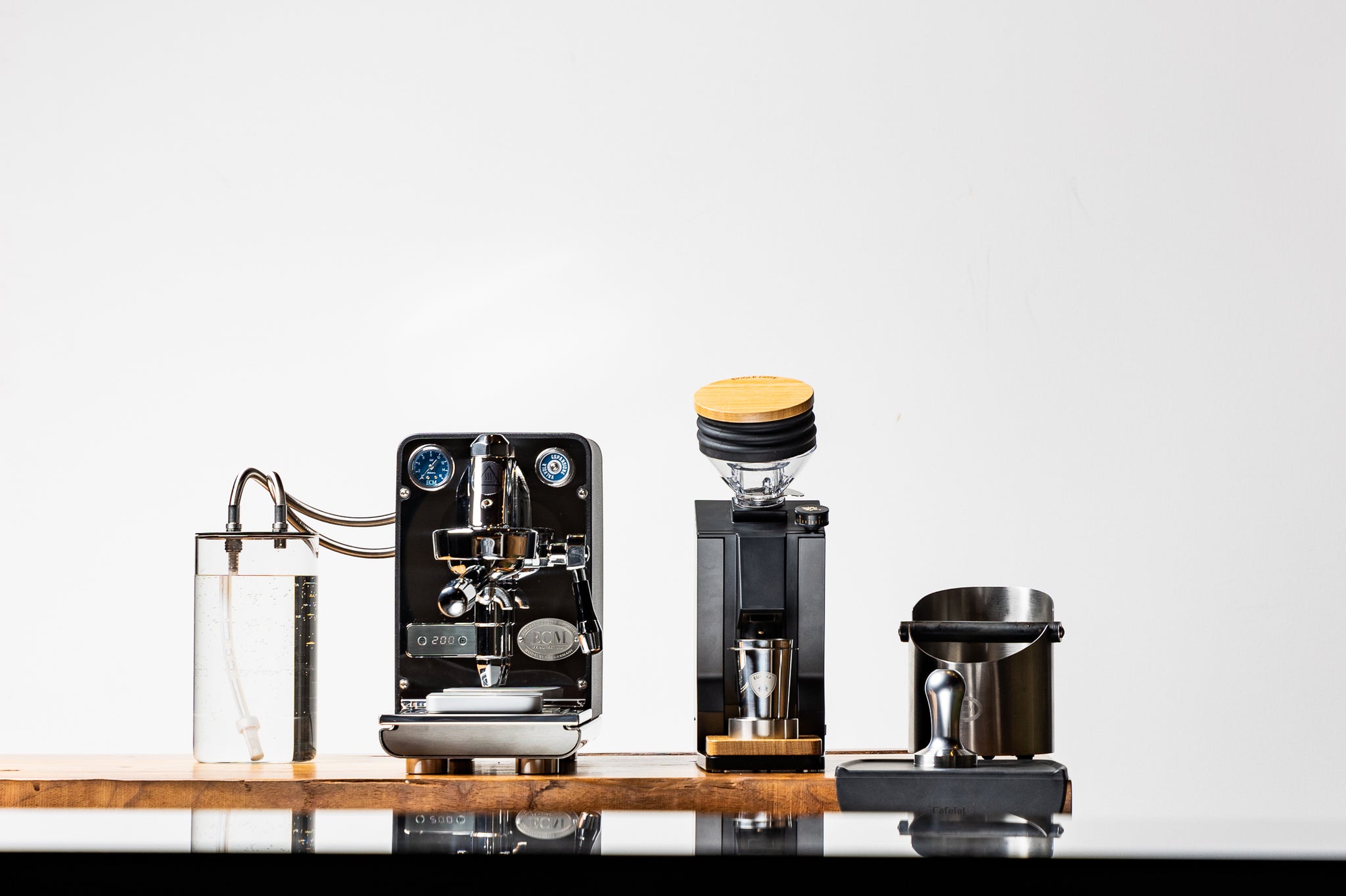 ECM Puristika single boiler espresso machine with the Eureka Oro Mignon Single Dose grinder and ECM knock box