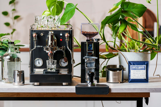 lucca x58 espresso machine and eureka libra espresso grinder in black lifestyle photo by clive coffee