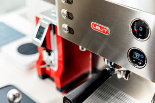 Close up of Lelit Elizabeth espresso machine front panel with logo and gauges.