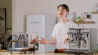 LUCCA M58 Sunto & ECM Synchronika II being described, by talent, in front of the camera, lifestyle, by Clive Coffee. 