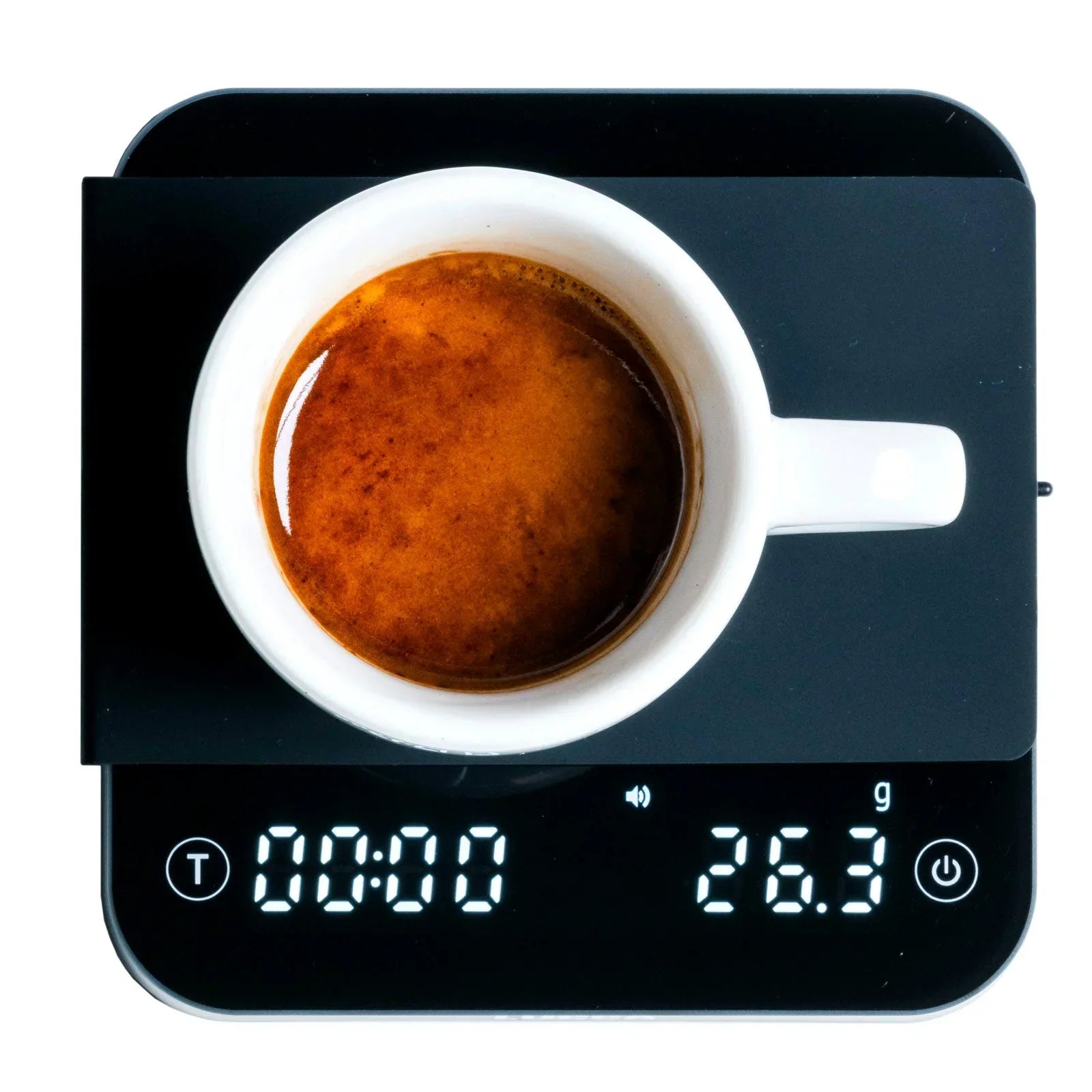 Top view of a white ceramic espresso cup on a digital kitchen scale