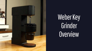 Weber Key Grinder on a wooden counter against a navy panel that reads Weber Key Grinder Overview