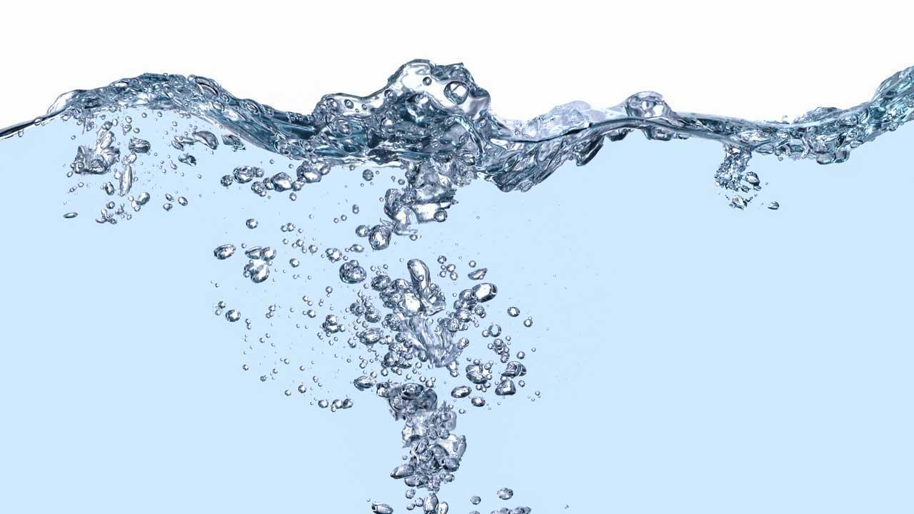 Splashing water with bubbles illustrating espresso water composition