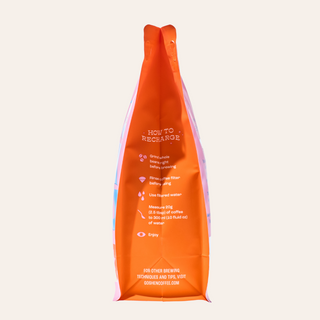 Orange Goshen Coffee Founders bag with brewing tips printed on the front