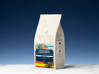 Colombia Community Kaldi's Coffee bag with colorful label artwork and origin details.