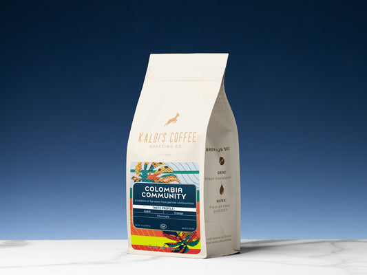 Colombia Community Kaldi's Coffee bag with colorful label artwork and origin details.