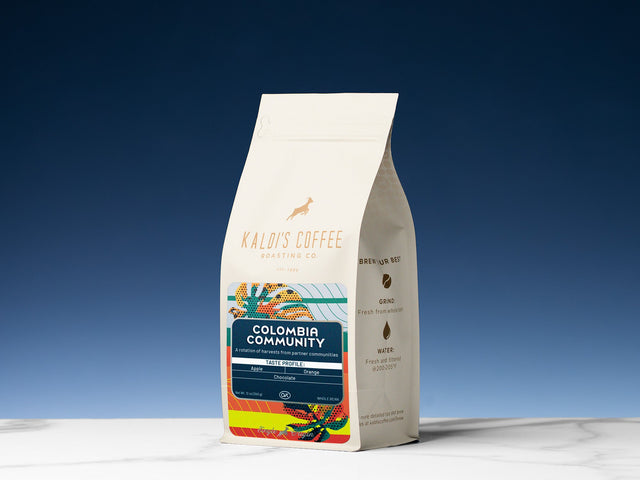 Colombia Community Kaldi's Coffee bag with colorful label artwork and origin details.