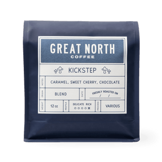 Kickstep coffee bag by Great North Coffee with a blue label and vintage farm illustration