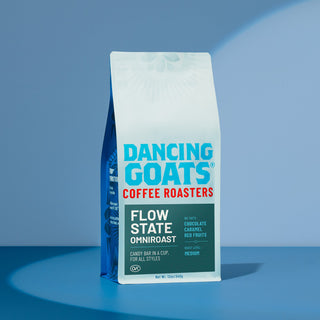Flow State Omniroast bag from Dancing Goats Coffee Roasters on a blue background