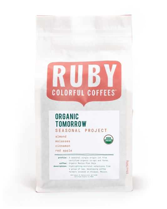 Ruby Coffee Roasters Organic Tomorrow Seasonal Project bag with large red RUBY logo and organic certification badge.