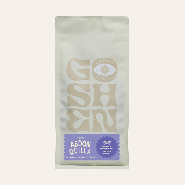 Close-up of Peru Abdon Quilla Ochochoque coffee bag with a pale front and a faded logo at the bottom
