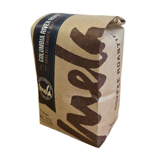 Bag of Columbia River Roast coffee with a dark blue label and bold red accent