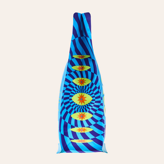 Tall blue and purple striped packaging wrapped around a vertical form against a pale background with yellow sunburst graphics.