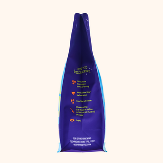 Guatemala Cachito coffee bag upright in purple with blue edges and yellow brewing tips printed on the front