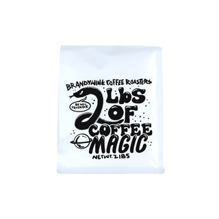 Coffee Magic bag featuring bold black typography on a white background