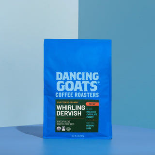Blue Dancing Goats coffee bag with bold white logo visible against a blue backdrop.
