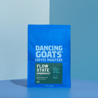 Close up of Flow State Dancing Goats coffee bag in blue packaging with bold Dancing Goats logo visible