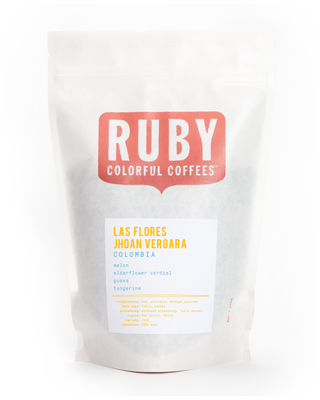 White coffee bag featuring Ruby Colorful Coffees logo and Las Flores Jhoan Vergara Colombia label