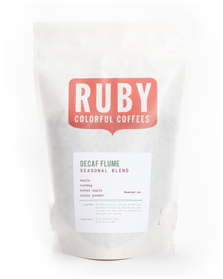 White coffee bag with a large red Ruby logo and Decaf Flume Seasonal Blend label