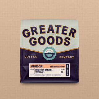 Greater Goods AM Rescue Breakfast Blend coffee bag with bold logo and retro labeling on a light background