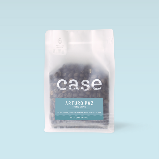 Case Coffee Honduras Arturo Paz bag with transparent lower section showing beans and a teal Arturo Paz label