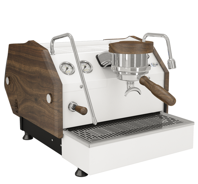 Close view of a La Marzocco GS3 espresso machine with wood side panels and front gauges.