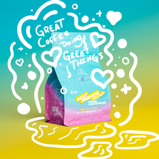 Best Friends Blend espresso bag from Cat & Cloud against a bright teal to yellow gradient with whimsical white doodles