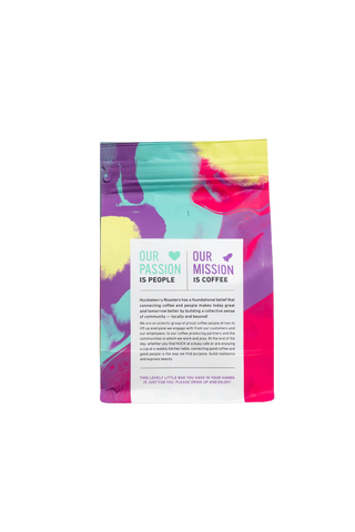 Skeleton Key Decaf coffee bag with bright abstract artwork and a white label.