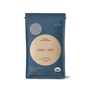 Hunky Dory Organic Decaffeinated whole bean coffee bag in blue packaging with round tan label