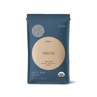Toketee organic coffee bag in blue packaging with a beige circular label reading TOKETEE and Blend