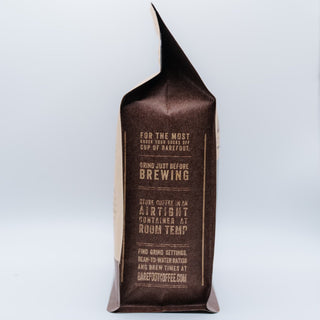 Limu coffee bag from Barefoot Coffee Roasters with a folded top and dark label