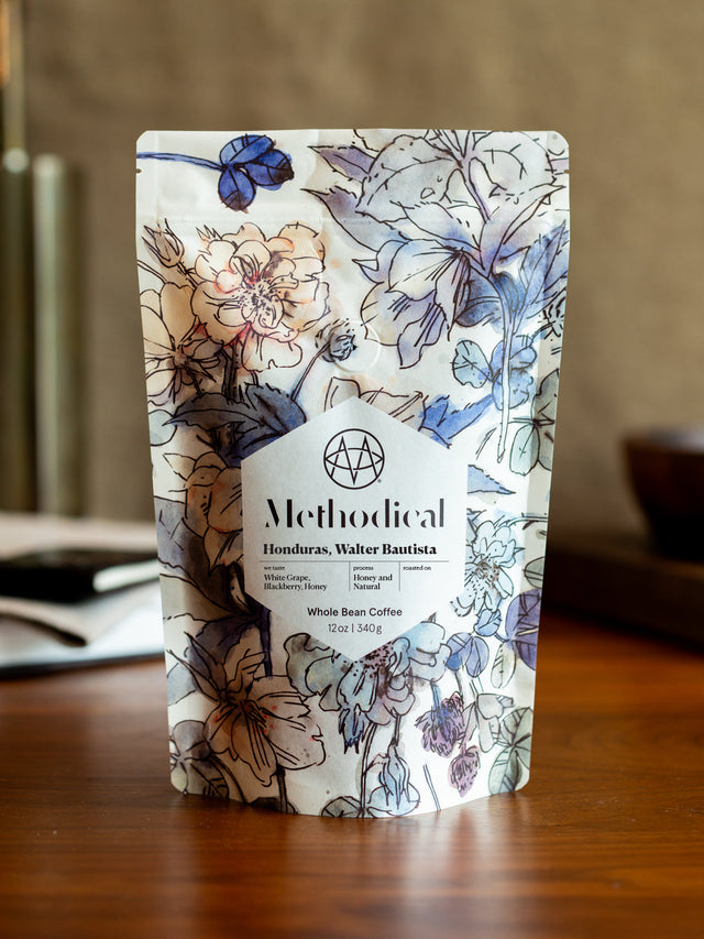 Methodical Honduras Walter Bautista whole bean coffee bag with blue floral pattern.