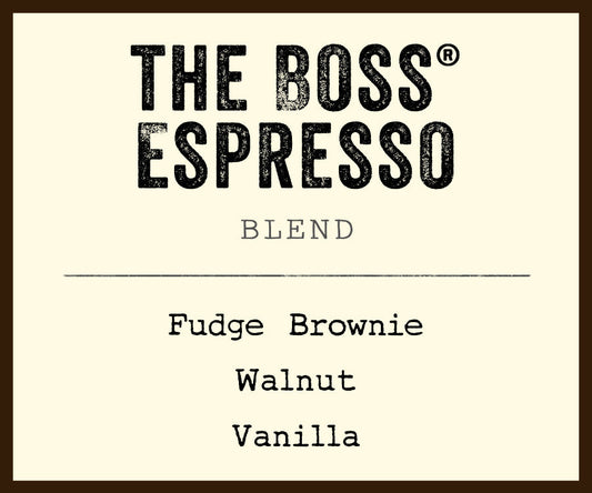 The Boss Espresso Blend label on a beige bag listing Fudge Brownie Walnut Vanilla flavors