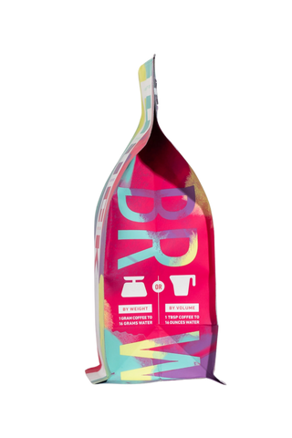 Front of Skeleton Key Decaf bag featuring bold pink purple graphics and product details.