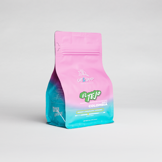 Colombia El Tejo single origin coffee bag on a light gray studio backdrop.