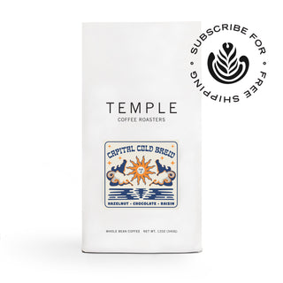 Capital Cold Brew bag with a colorful label showing a sun motif and flavor notes hazelnut chocolate raisin.