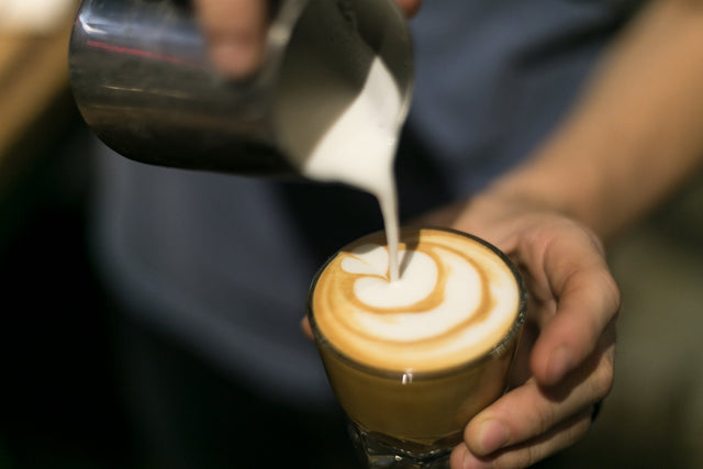 pouring latte art clive coffee lifestyle