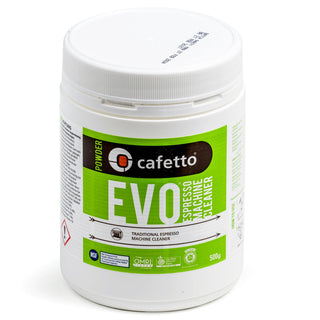 White EVO Espresso Machine Cleaner bottle with green label and safety icons