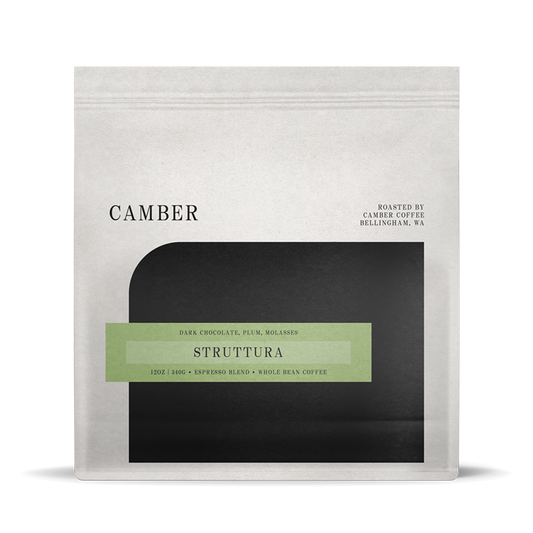 Camber Coffee Struttura espresso blend bag with pale green label on a light bag over a black rounded inset.