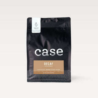 Decaf Colombia Case Coffee Roasters bag with white Ashland Oregon label on a black pouch