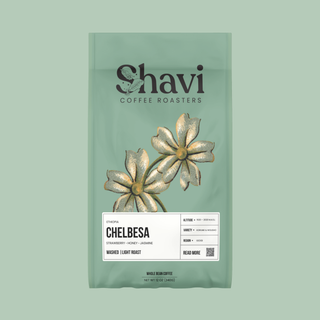 Mint green Shavi Coffee Roasters bag with the brand logo and a floral coffee plant illustration.