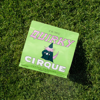 Quirky lime green coffee bag on grass from Cirque Coffee Roasters rotating single origin series