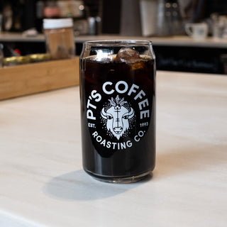 Close up of a glass of Cold Front iced coffee on a light countertop