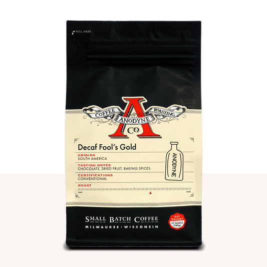 Decaf Fool's Gold coffee bag by Anodyne with cream label and red logo on black packaging