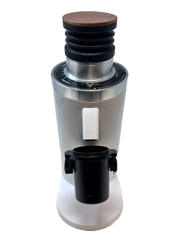 Angled side view of Turin DF64 Gen 2.5 showing wood top black bellows and stainless steel housing