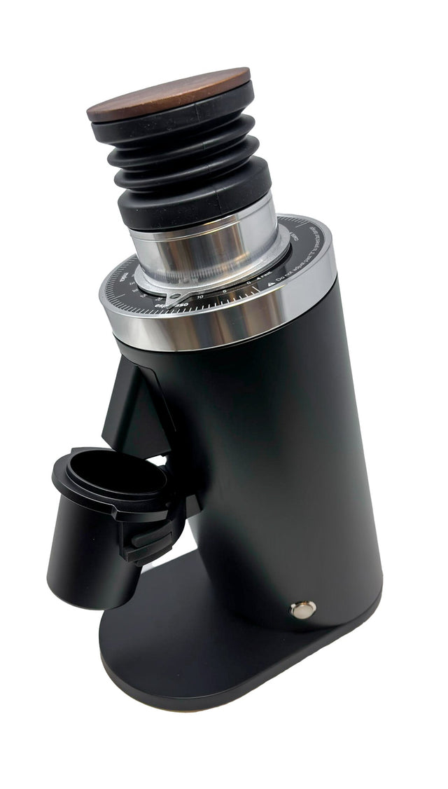 Close up of Turin DF64 Gen 2.5 grinder top with wooden knob black bellows and metal dial ring