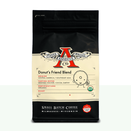 Donut's Friend Blend organic coffee bag from Anodyne Coffee Roasting Co with black top and cream label featuring a red A logo