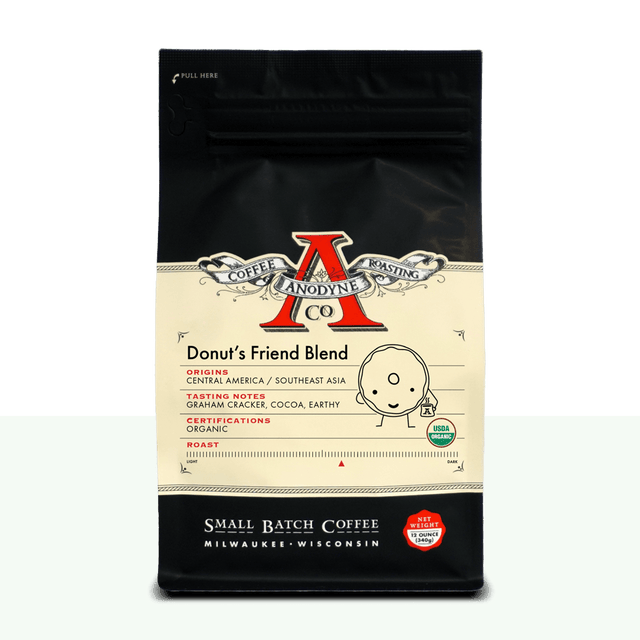 Donut's Friend Blend organic coffee bag from Anodyne Coffee Roasting Co with black top and cream label featuring a red A logo