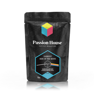 Darkest Side of the Moon coffee bag showing a bold hex label with a colorful accent on the black patterned bag.