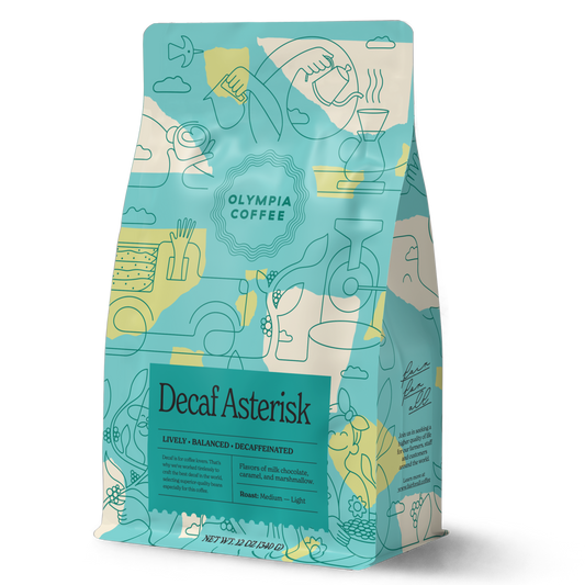 Decaf Asterisk bag from Olympia Coffee Roasting Company features teal packaging with abstract line art and yellow accents.